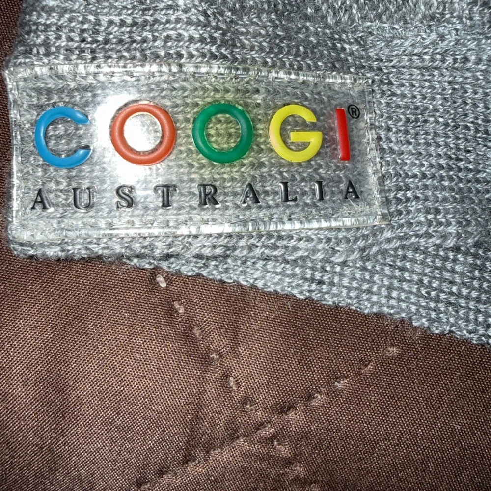 COOGI sweater raised